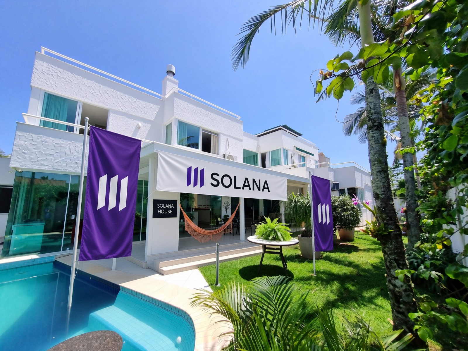 Solana House exterior beside the pool with purple Solana banners